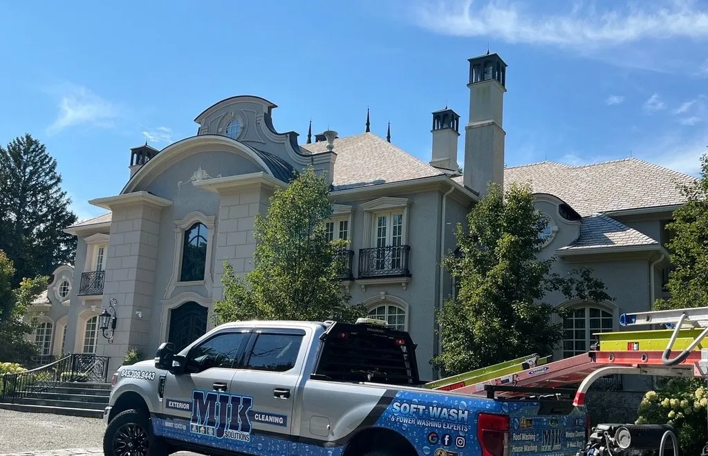 MJK Solutions soft wash truck on site at a stone estate home in Dutchess County, NY