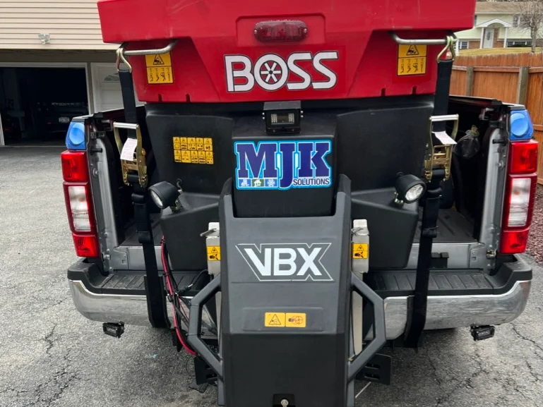 MJK Solutions truck-mounted salt spreader loaded with treated salt before a Hudson Valley storm